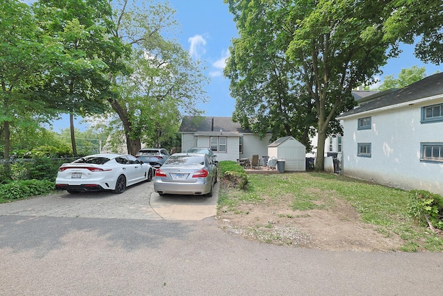 392 Plum Ct, Elgin, IL 60120 - bungalow-style house with a shed and driveway