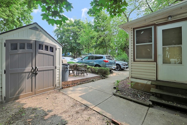 392 Plum Ct, Elgin, IL 60120 - garage featuring a storage shed