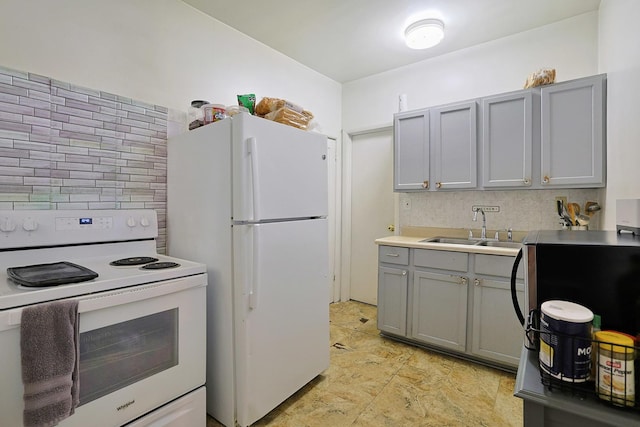 392 Plum Ct, Elgin, IL 60120 - kitchen with white appliances, gray cabinets, decorative backsplash, and light countertops