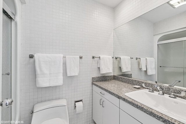 1707 Lynwood Ct, Flossmoor, IL 60422 - bathroom with tile walls, vanity, and a shower with shower door