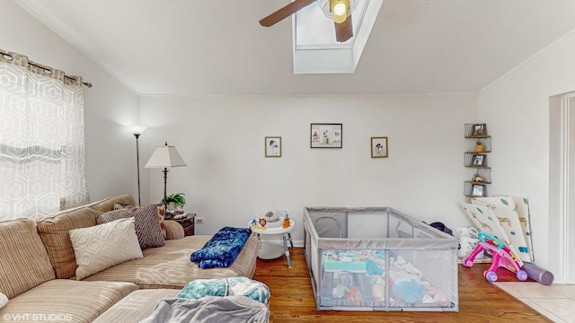 1910 N 76th Ct, Elmwood Park, IL 60707 - living room featuring ceiling fan, wood finished floors, and ornamental molding