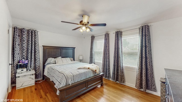 1910 N 76th Ct, Elmwood Park, IL 60707 - bedroom featuring light wood finished floors and a ceiling fan