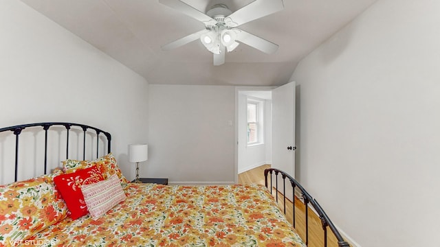 1910 N 76th Ct, Elmwood Park, IL 60707 - bedroom with lofted ceiling, ceiling fan, wood finished floors, and baseboards