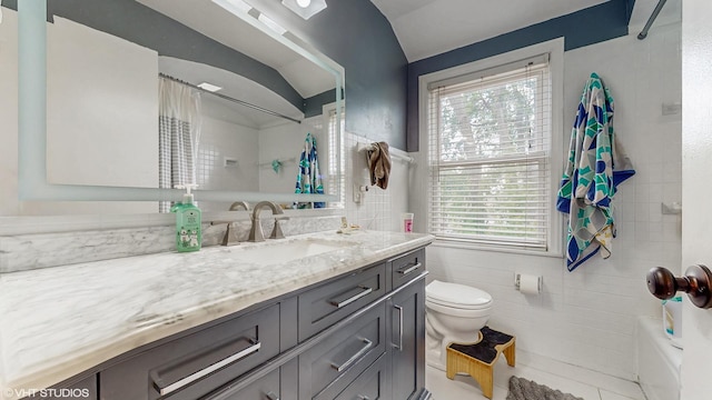 1910 N 76th Ct, Elmwood Park, IL 60707 - bathroom featuring tile walls, vanity, healthy amount of natural light, toilet, and shower / tub combo