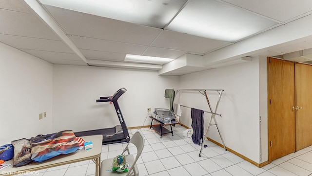 1910 N 76th Ct, Elmwood Park, IL 60707 - workout area with a drop ceiling, baseboards, and light tile patterned flooring
