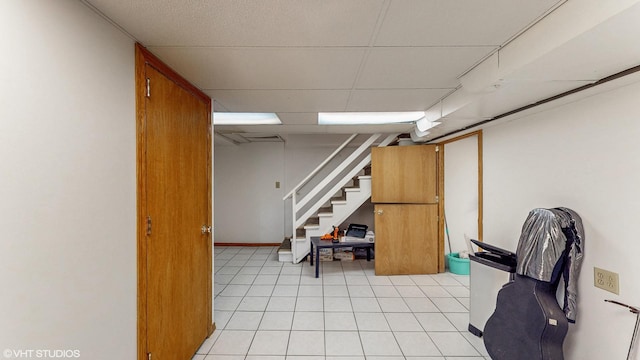 1910 N 76th Ct, Elmwood Park, IL 60707 - finished below grade area featuring stairs, light tile patterned floors, and a drop ceiling