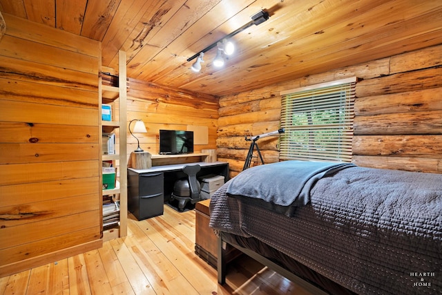 8753 Camp Lake Rd, Salem, WI 53168 - bedroom with light wood-style flooring, wooden ceiling, rustic walls, and rail lighting