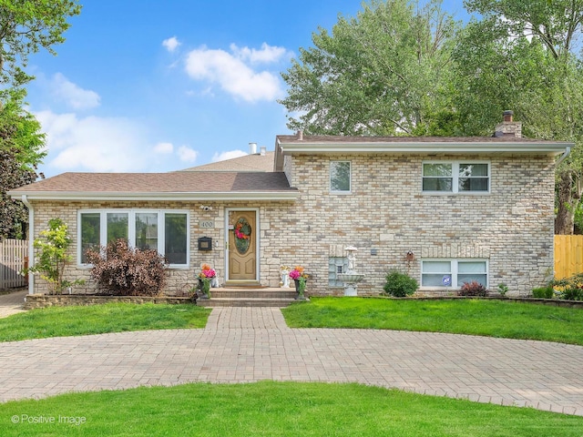 400 E Garwood Ave, Mount Prospect, IL 60056 - split level home with a chimney, roof with shingles, and brick siding