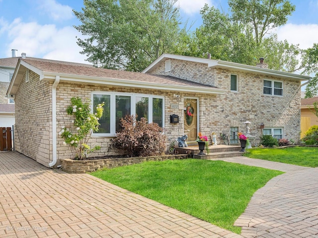400 E Garwood Ave, Mount Prospect, IL 60056 - tri-level home featuring a front lawn, brick siding, a chimney, and a shingled roof