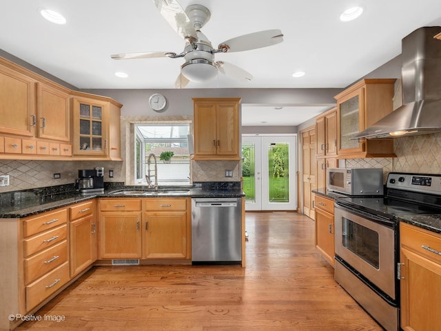 400 E Garwood Ave, Mount Prospect, IL 60056 - kitchen featuring stainless steel appliances, wall chimney exhaust hood, healthy amount of natural light, tasteful backsplash, and recessed lighting