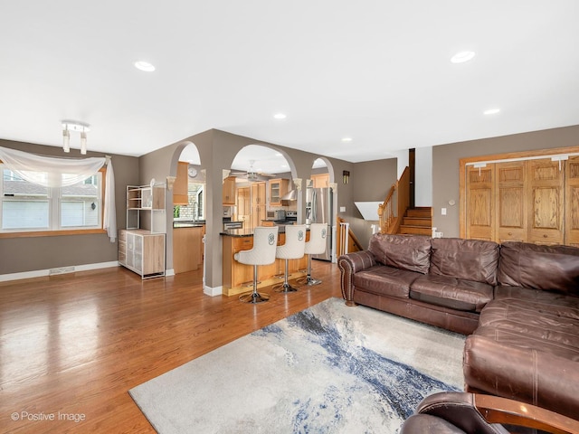 400 E Garwood Ave, Mount Prospect, IL 60056 - living area featuring arched walkways, wood finished floors, stairs, and recessed lighting