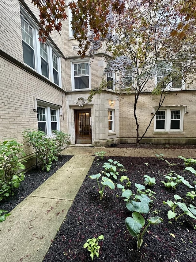 1453 W Elmdale Ave Unit 1, Chicago, IL 60660 - doorway to property with brick siding