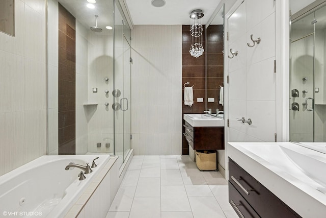 1350 W Diversey Pkwy Unit 1, Chicago, IL 60614 - full bath with tile walls, a stall shower, vanity, tile patterned flooring, and a jetted tub
