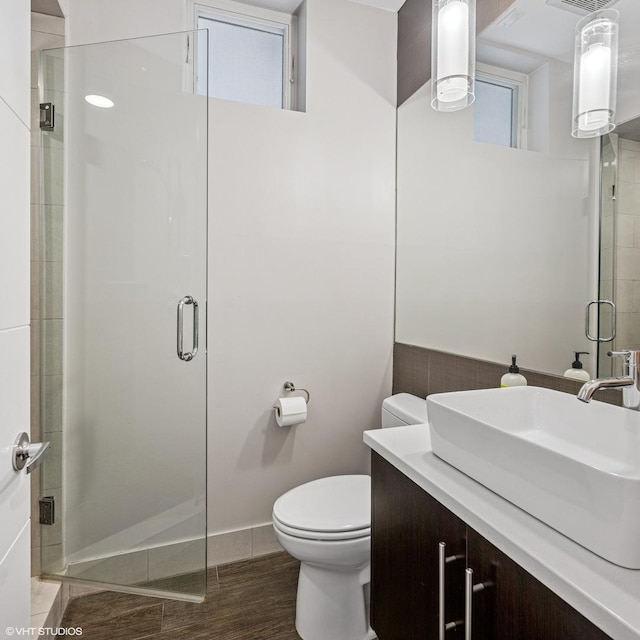 1350 W Diversey Pkwy Unit 1, Chicago, IL 60614 - bathroom featuring a stall shower, vanity, and wood finished floors