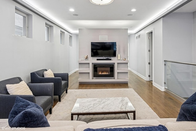 1350 W Diversey Pkwy Unit 1, Chicago, IL 60614 - living room with wood finished floors, a glass covered fireplace, and recessed lighting