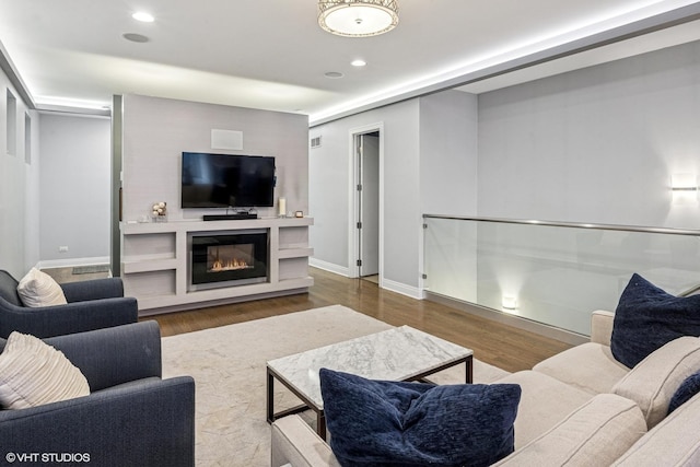 1350 W Diversey Pkwy Unit 1, Chicago, IL 60614 - living area with wood finished floors, a glass covered fireplace, and recessed lighting