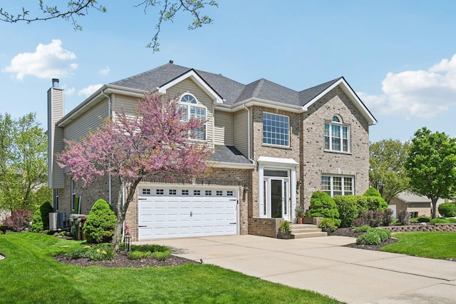 949 Ruthenbeck Ln, New Lenox, IL 60451 - traditional-style home featuring brick siding, driveway, an attached garage, a front lawn, and a chimney