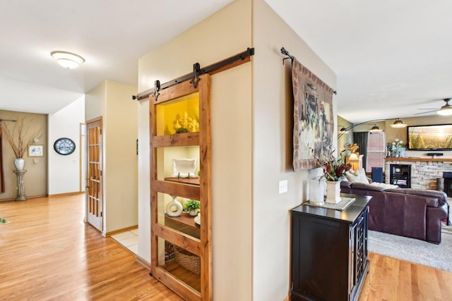 949 Ruthenbeck Ln, New Lenox, IL 60451 - hall with a barn door and light wood finished floors