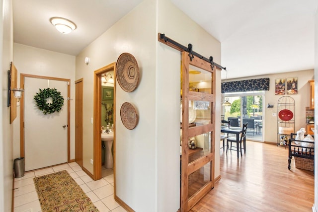949 Ruthenbeck Ln, New Lenox, IL 60451 - entryway featuring a barn door and light tile patterned floors