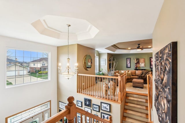 949 Ruthenbeck Ln, New Lenox, IL 60451 - stairs with a tray ceiling, a chandelier, and ceiling fan