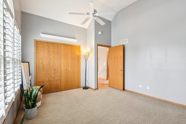 949 Ruthenbeck Ln, New Lenox, IL 60451 - unfurnished bedroom featuring high vaulted ceiling, carpet, a closet, and ceiling fan