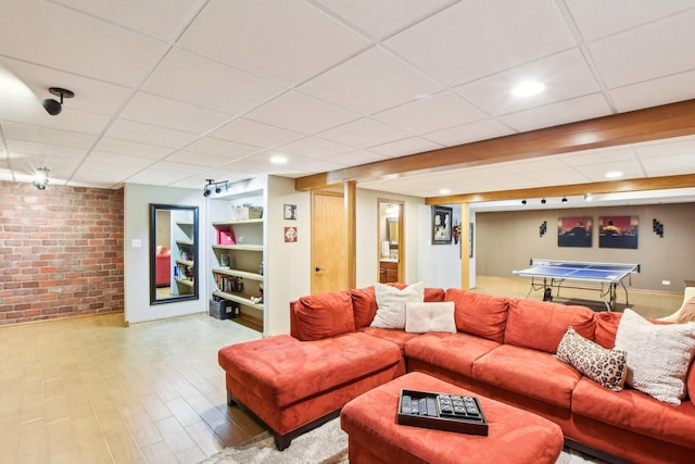 949 Ruthenbeck Ln, New Lenox, IL 60451 - living room with brick wall, a paneled ceiling, and wood finished floors