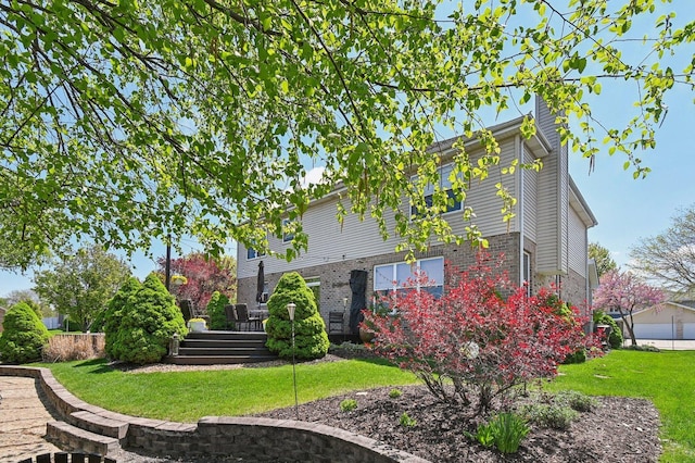 949 Ruthenbeck Ln, New Lenox, IL 60451 - view of side of home featuring a yard, a chimney, and brick siding
