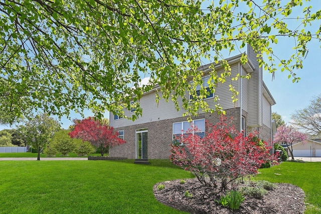949 Ruthenbeck Ln, New Lenox, IL 60451 - view of property exterior with a yard, a chimney, and brick siding
