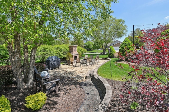 949 Ruthenbeck Ln, New Lenox, IL 60451 - view of yard with an outdoor stone fireplace and a patio area