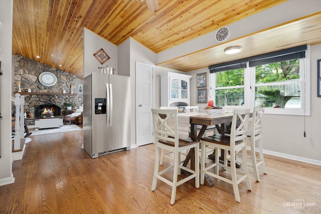 124 Fairview Dr, Saint Charles, IL 60174 - dining area featuring wooden ceiling, lofted ceiling, light wood-style flooring, and a fireplace
