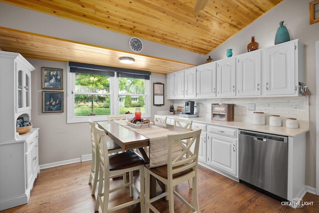 124 Fairview Dr, Saint Charles, IL 60174 - kitchen featuring dishwasher, wood ceiling, white cabinets, tasteful backsplash, and light countertops
