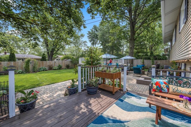 124 Fairview Dr, Saint Charles, IL 60174 - deck featuring a fenced backyard, a patio area, and outdoor dining area