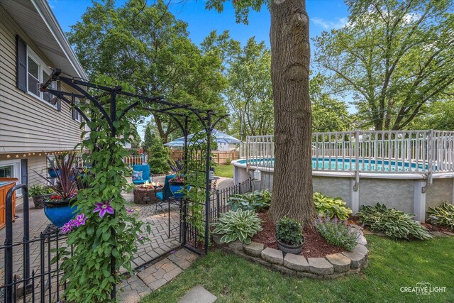 124 Fairview Dr, Saint Charles, IL 60174 - view of yard featuring an outdoor fire pit and a patio area