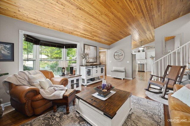 124 Fairview Dr, Saint Charles, IL 60174 - living area featuring lofted ceiling, stairway, wooden ceiling, and wood finished floors