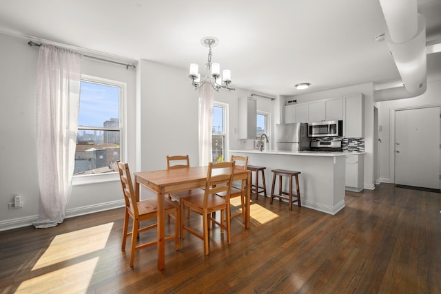 1322 W Huron St Unit 4N, Chicago, IL 60642 - dining area featuring a chandelier and dark wood finished floors