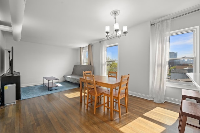 1322 W Huron St Unit 4N, Chicago, IL 60642 - dining space featuring a chandelier and wood finished floors