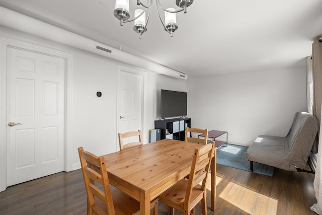 1322 W Huron St Unit 4N, Chicago, IL 60642 - dining area featuring dark wood-type flooring and a chandelier