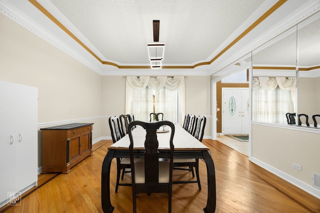 401 Jason Ln, Schaumburg, IL 60173 - dining area featuring ornamental molding and light wood-style floors