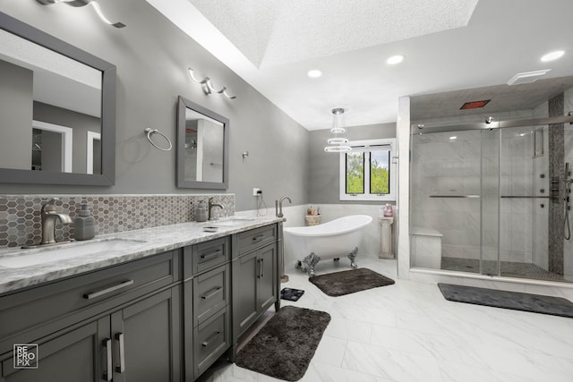 401 Jason Ln, Schaumburg, IL 60173 - full bath featuring double vanity, marble look tiles, a shower stall, a freestanding bath, and recessed lighting