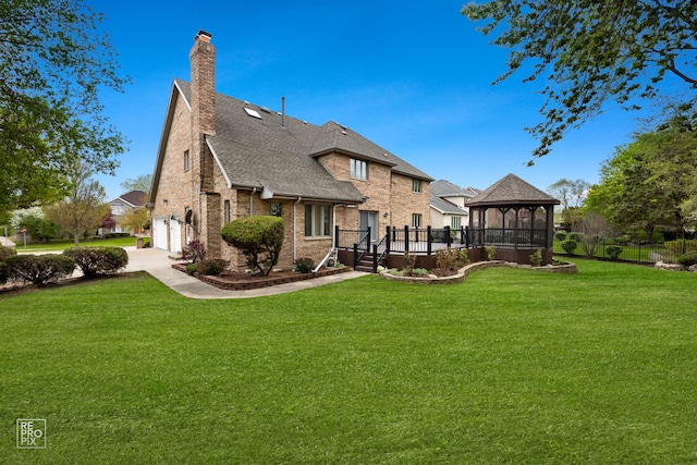 401 Jason Ln, Schaumburg, IL 60173 - rear view of property featuring a gazebo, brick siding, a chimney, an attached garage, and roof with shingles