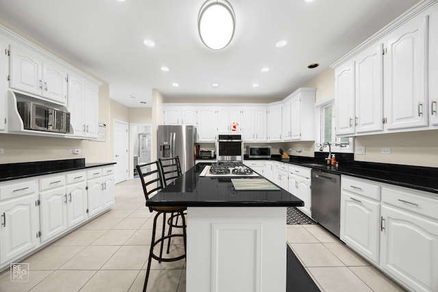 401 Jason Ln, Schaumburg, IL 60173 - kitchen with stainless steel appliances, light tile patterned floors, white cabinets, dark countertops, and recessed lighting