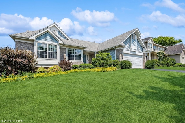 6254 Old Farm Ln, Gurnee, IL 60031 - view of front of house with a front lawn, brick siding, an attached garage, and a shingled roof