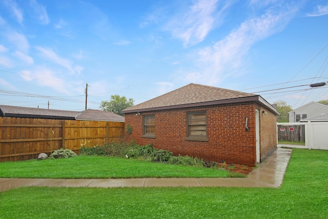 2424 Birch Ave, Whiting, IN 46394 - view of home's exterior with a shingled roof and brick siding