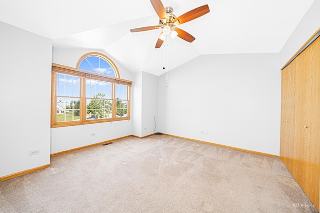 9963 Constitution Dr, Orland Park, IL 60462 - unfurnished bedroom with vaulted ceiling, carpet, a closet, and ceiling fan