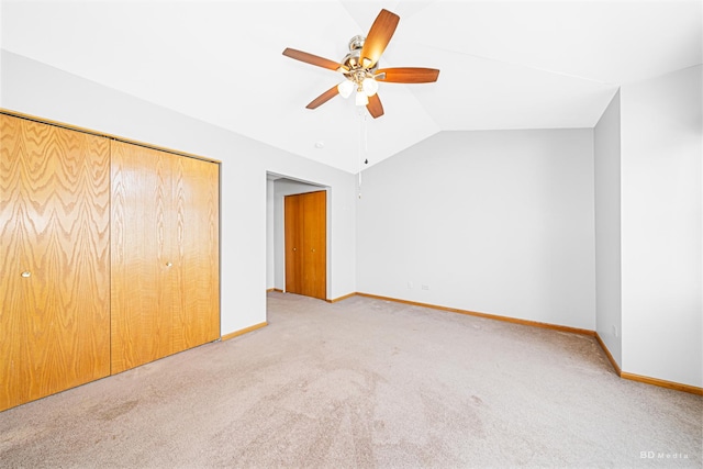 9963 Constitution Dr, Orland Park, IL 60462 - unfurnished bedroom with carpet flooring, vaulted ceiling, a closet, and a ceiling fan