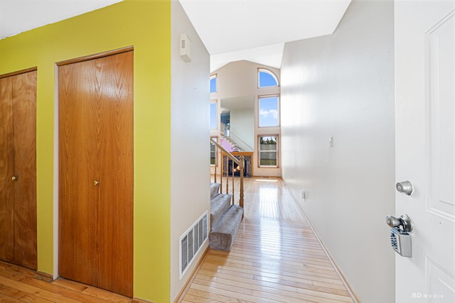 9963 Constitution Dr, Orland Park, IL 60462 - hallway featuring hardwood / wood-style floors, stairs, and a towering ceiling