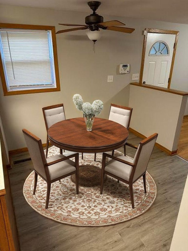 9957 Moody Ave, Oak Lawn, IL 60453 - dining space featuring wood finished floors, a ceiling fan, and baseboards