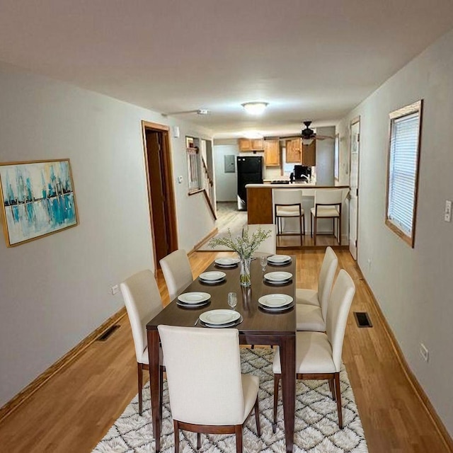9957 Moody Ave, Oak Lawn, IL 60453 - dining area with light wood finished floors, baseboards, stairs, and a ceiling fan