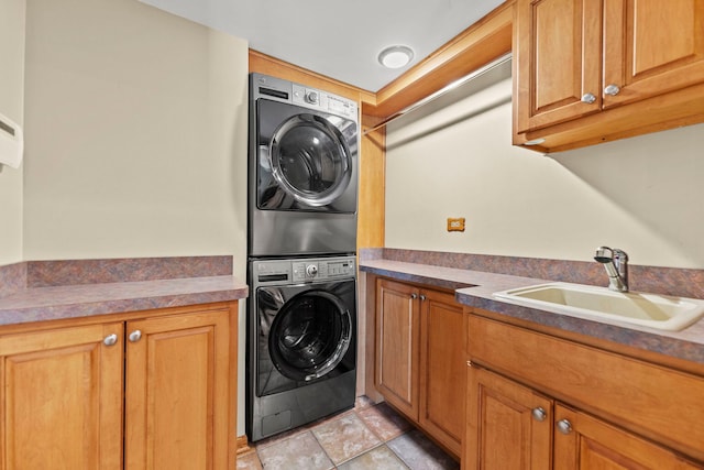1164 Winding Glen Dr, Carol Stream, IL 60188 - laundry area featuring stacked washer / drying machine, cabinet space, and stone finish floors
