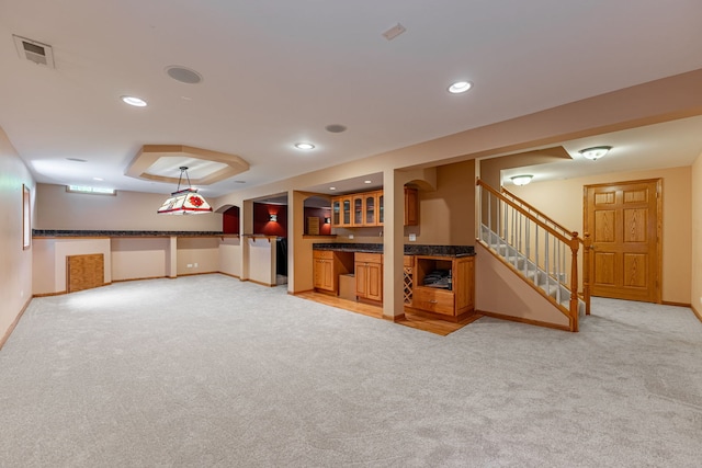1164 Winding Glen Dr, Carol Stream, IL 60188 - finished basement featuring bar with sink, light carpet, stairway, and recessed lighting